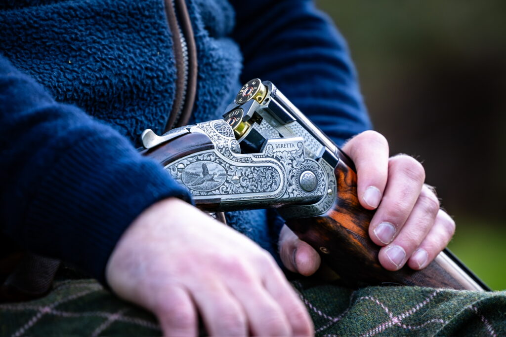 Close-up of an engraved shotgun used for game and wing shooting